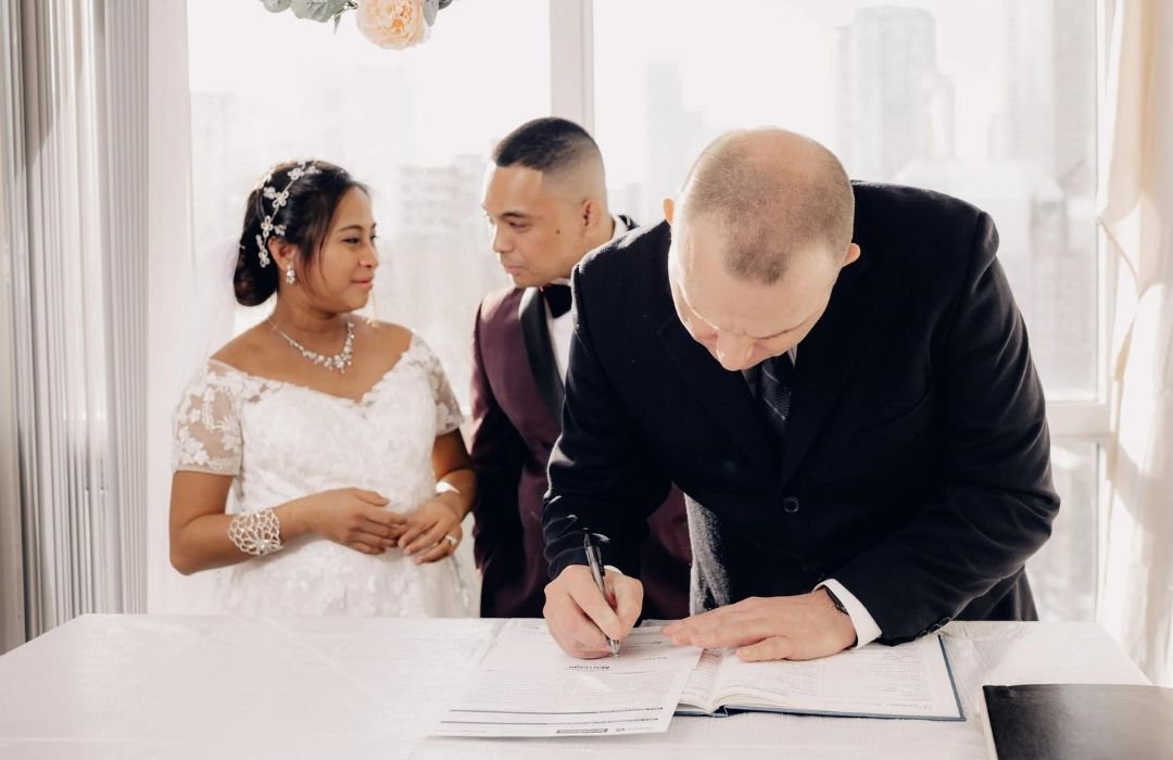 Same day wedding officiant in Winnipeg completing a quick legal marriage ceremony